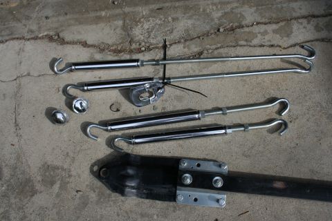 1995 Jeep Cherokee - Set of tie-down straps and hardware laid out on a concrete surface.