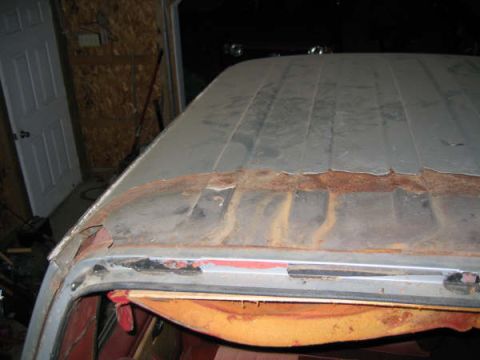 1986 Ford C-350 (Centurion Conversions) - The roof of the vehicle shows significant rust and damage along the seams.