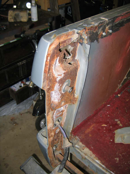 1986 Ford C-350 (Centurion Conversions) - The rear corner of this vehicle shows significant rust damage, obscuring any specific year identification.