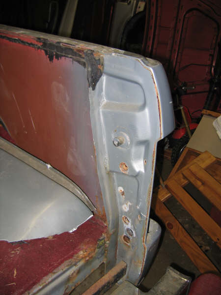 1986 Ford C-350 (Centurion Conversions) - Detail of a heavily rusted vehicle body panel, likely undergoing repair or restoration.