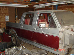 1986 Ford C-350 (Centurion Conversions) - This 1987 Ford C-350 Centurion Conversion pickup truck is shown from the front three-quarter angle in a garage.