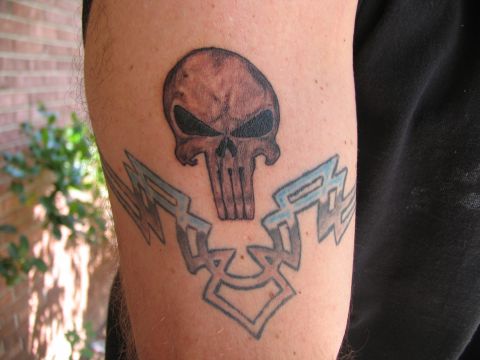 1993 Ford Bronco - A tattoo of a skull and tribal patterns is visible on a person's arm.