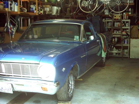 1966 Ford Ranchero - This 1966 Ford Ranchero pickup truck is shown from a three-quarter front angle inside a garage.