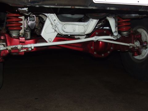 1988 Ford F-150 - Close-up view of the vehicle's undercarriage, focusing on the rear axle and suspension.