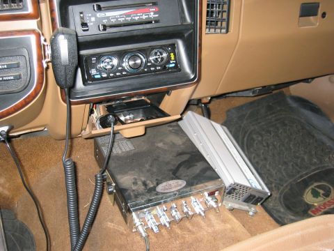 1990 Ford Bronco - Aftermarket electronics including a CB radio and amplifier are installed in the vehicle's interior.