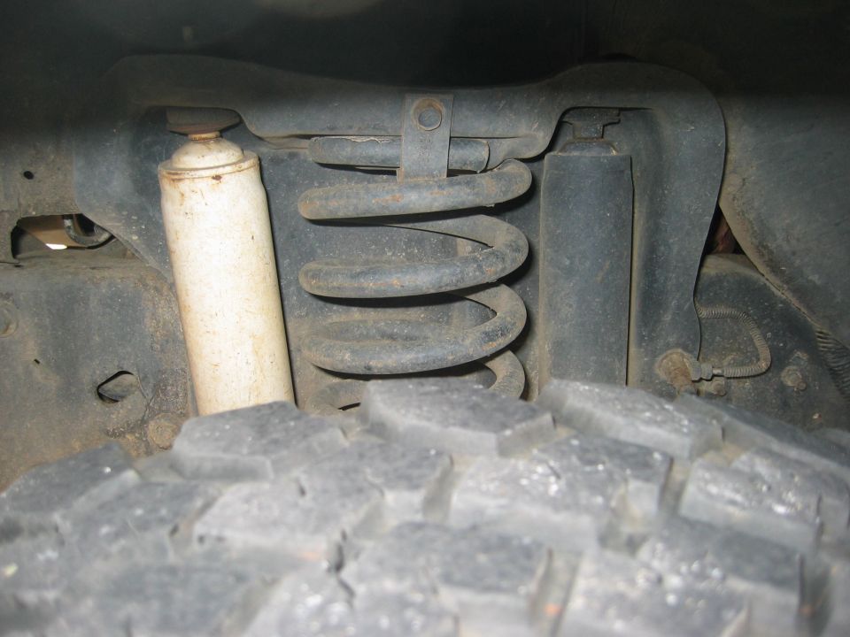 Front suspension coil spring and shock absorber