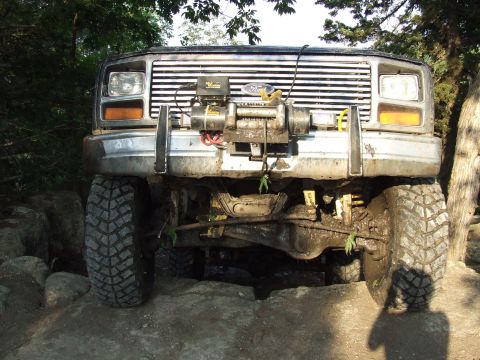 1986 Ford Bronco - This 1980s Ford Bronco is equipped with a winch and appears to be off-roading.