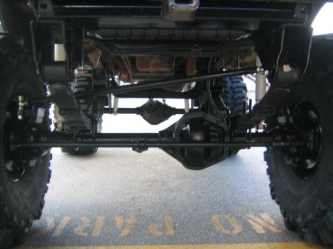1979 Ford Bronco - The underside of a vehicle is shown, focusing on the suspension and drivetrain, with no clear year identification.