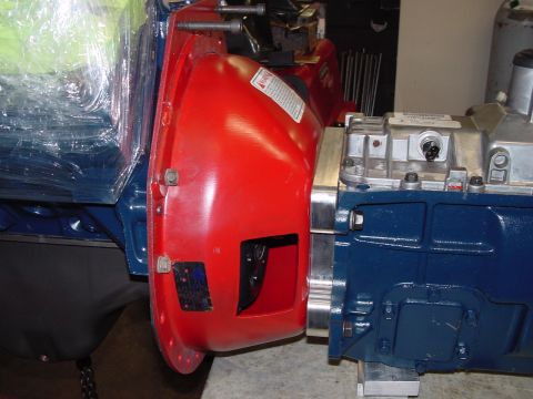 1979 Ford Bronco - Close-up view of industrial machinery parts, including a blue engine block and a red housing.