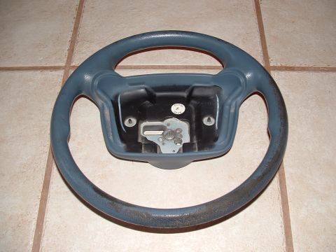 1990 Ford Bronco - Steering wheel part shown from the front, with visible wear on the grip.