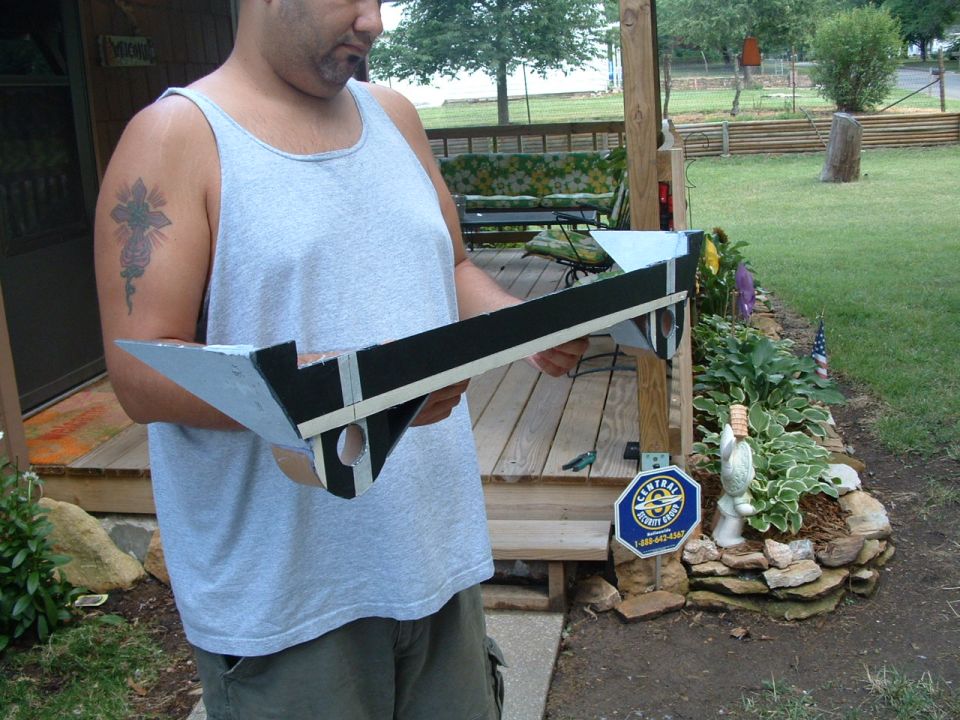 my cuz holding it facing front