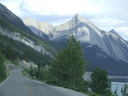 1988 Ford Bronco - Scenic mountain view with a road leading through the landscape.