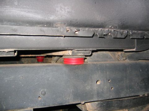 1979 Ford Bronco - Red polyurethane body mounts are visible between the vehicle's frame and body panels.