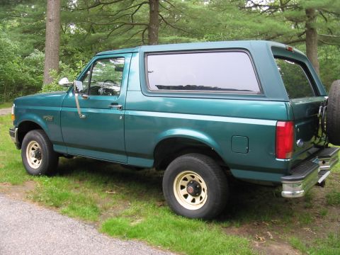 1996 Ford Bronco - This 1996 Ford Bronco is seen from a 3/4 front angle, its iconic body style and a spare tire mounted on the rear.