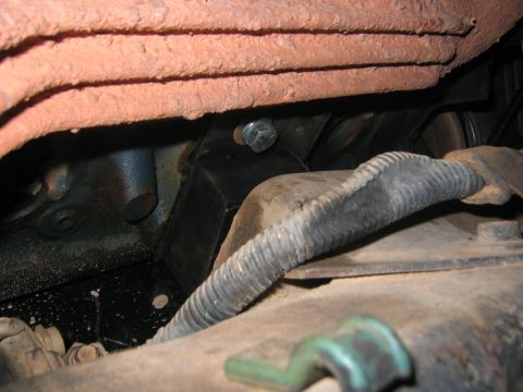 1979 Ford Bronco - Nasty looking wire loom... Nice looking motor mounts... and soon to be trashed manifolds... well ok maybe ill keep them if somone wants the…