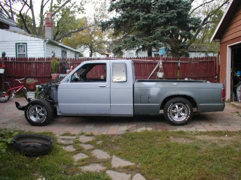 1998 Ford Taurus - This pickup truck is missing its front end and appears to be undergoing some form of modification or repair.