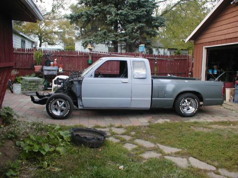 1998 Ford Taurus - Pickup truck project in progress, with the engine bay disassembled and body panels primed.