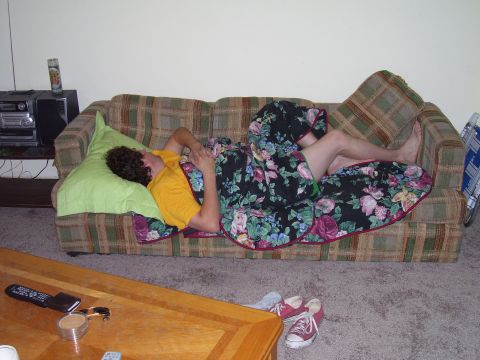 1992 Ford Bronco - Someone is taking a nap on the couch, covered with a floral blanket.
