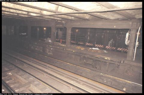 1986 Ford Bronco - This is a scene of an abandoned subway platform with graffiti and debris visible.