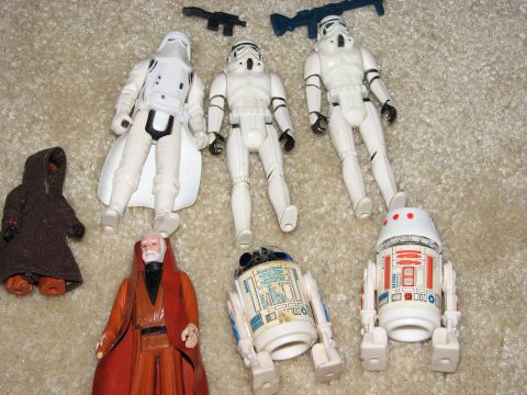 1991 Ford Bronco - Collection of vintage Star Wars action figures displayed on a carpeted surface.