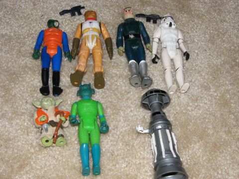 1991 Ford Bronco - Collection of vintage Star Wars action figures and accessories laid out on a carpeted surface.