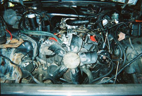 1988 Ford Bronco - Engine bay with various components and wiring visible.