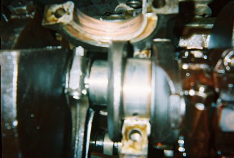 1988 Ford Bronco - Main bearing with crank and rod journal showing wear.
