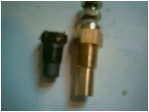 1997 Mercury Grand Marquis - This is trans bolt used for Forced tailshaft lube and next to it is my transmission temp sensor. I have decided NOT to use this method for…