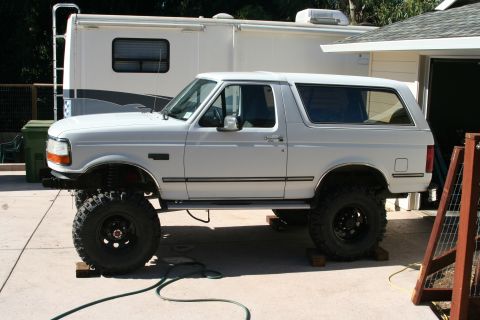1992 Ford Bronco - This lifted 1992 Ford Bronco features large off-road tires and a prominent side profile.