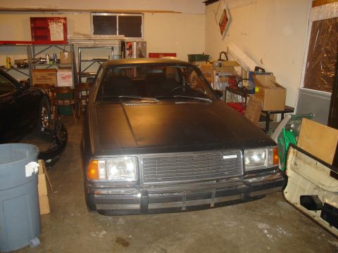 1997 Ford Probe - This car appears to be a Mazda, not a 1997 Ford Probe, based on its grille and headlights.