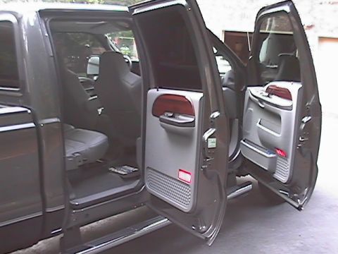 2005 Ford F-250 - Interior view of a 2005 Ford F-250 pickup truck, showing the front and rear cabin space.