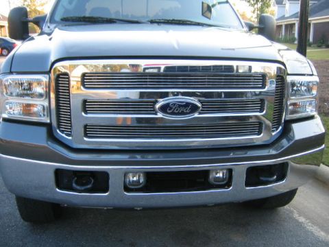2005 Ford F-250 - Close-up of the front grille and headlights of a Ford Super Duty truck.