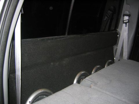 2005 Ford F-250 - Custom subwoofer box with three speakers visible inside a vehicle's interior.