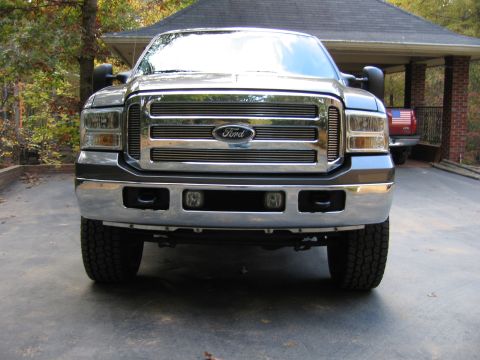 2005 Ford F-250 - Front view of a 2005 Ford F-250 pickup truck, showing its chrome grille and bumper.