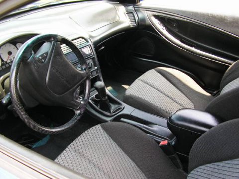 1994 Ford Probe - Interior view of a 1994 Ford Probe, showing the dashboard, steering wheel, and front seats.
