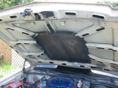 1985 Ford LTD Crown Victoria - View under the hood of a car, showing insulation and engine parts. Supermotors.net logo is present.