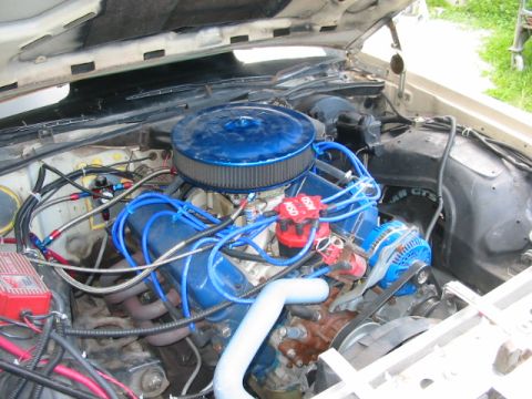 1985 Ford LTD Crown Victoria - Engine bay details with custom modifications visible, including aftermarket ignition components and air intake.