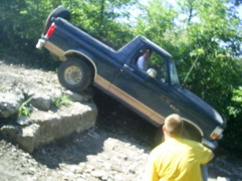 1994 Ford Bronco - This 1994 Ford Bronco is shown off-roading on a challenging rocky path.