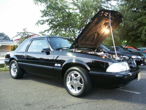 2001 Mercury Grand Marquis - Black coupe parked outdoors with hood raised, revealing the engine compartment.