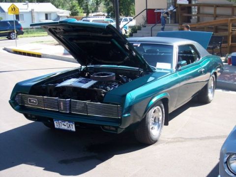 1972 Ford Ranchero - This 1969 Mercury Cougar XR7 has its hood open, revealing the engine and interior details.