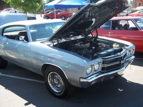 1972 Ford Ranchero - This silver muscle car, likely a 1970 model, is displayed with its hood open, revealing the engine and SS badging.