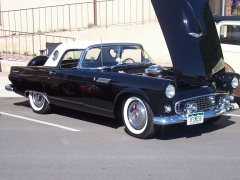 1972 Ford Ranchero - Black 1956 Ford Thunderbird convertible with hood open, showing engine details.