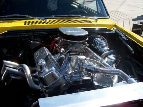 1972 Ford Ranchero - Close-up view of a highly customized V8 engine, polished chrome components and performance headers.