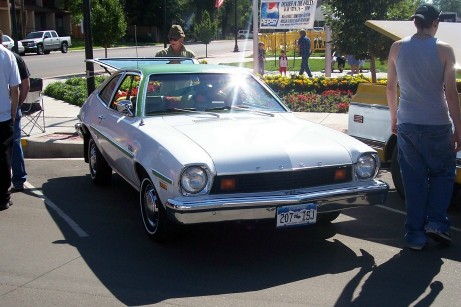 1972 Ford Ranchero - This two-tone coupe features a distinctive green spoiler and a green roof, with a license plate reading 207-TSJ.