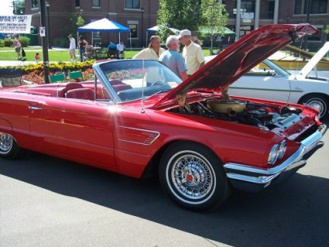 1972 Ford Ranchero - A red 1962 Ford Thunderbird convertible is displayed with its hood open at an outdoor event.
