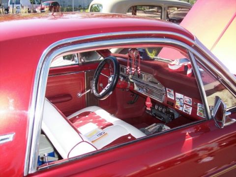 1972 Ford Ranchero - Interior view of a 1972 Ford Ranchero, red and white upholstery and a classic dashboard.