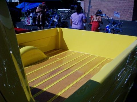 1972 Ford Ranchero - The bed of a yellow 1972 Ford Ranchero features a wood floor with yellow accents.
