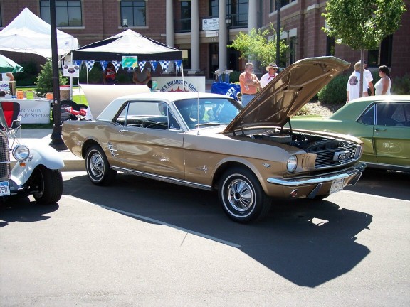 Gold 1965 Ford Mustang coupe with hood open
