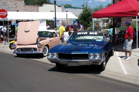 1972 Ford Ranchero - Two classic convertibles are displayed at an outdoor event.