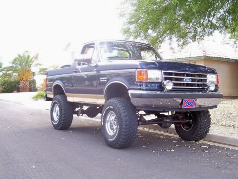 1991 Ford Bronco - This lifted 1991 Ford Bronco has a custom look with its large tires and chrome wheels.